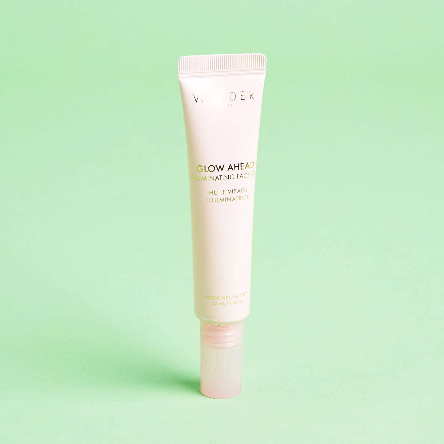 light pink tube of beauty oil