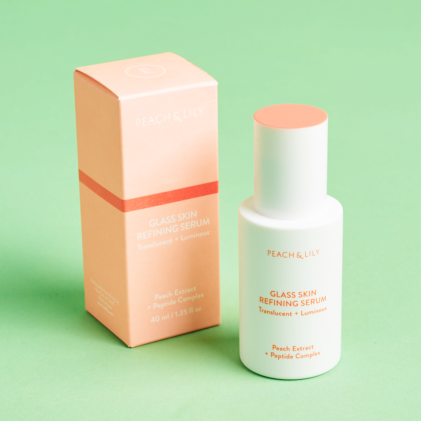 peach colored box and white bottle