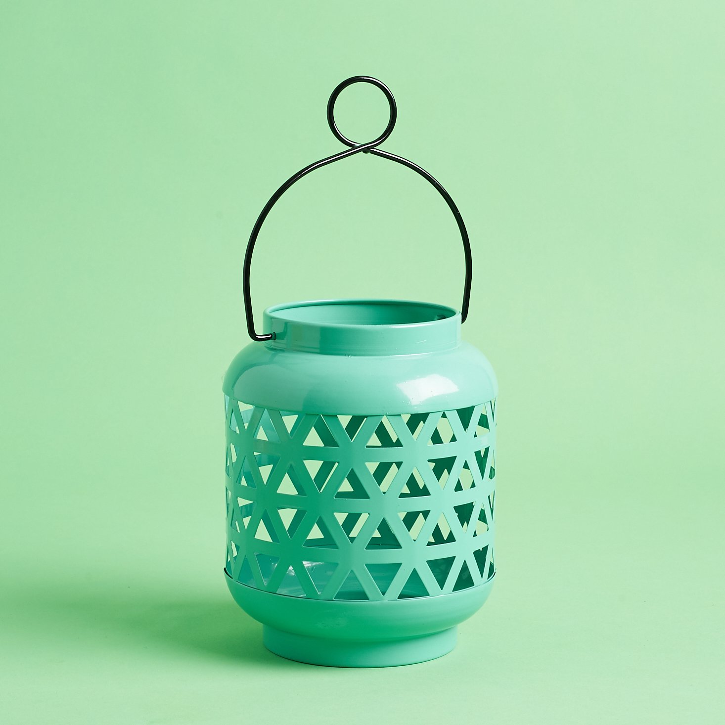 teal lantern vessel with black handle