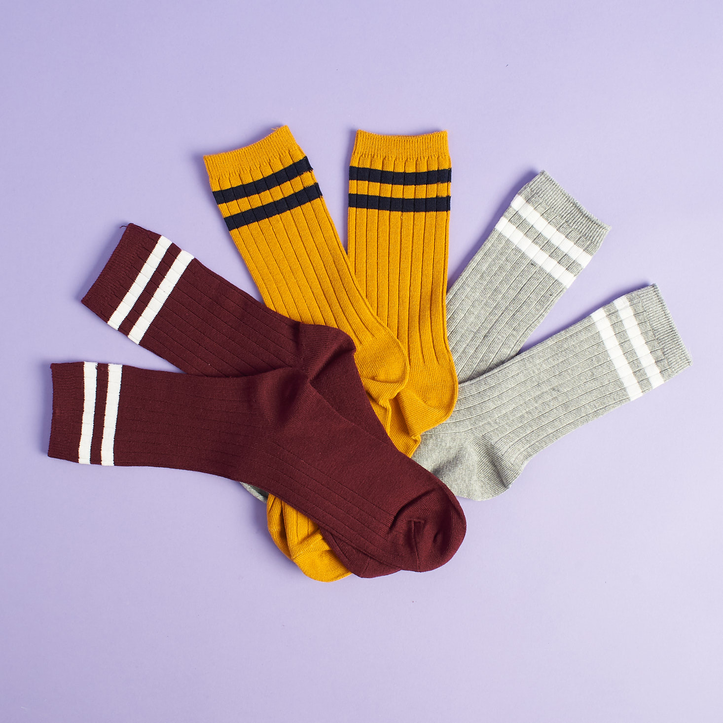 three sets of crew socks in autumn colors fanned out