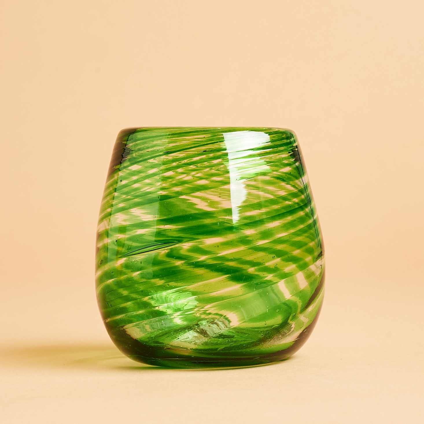 green blown stemless glass side view