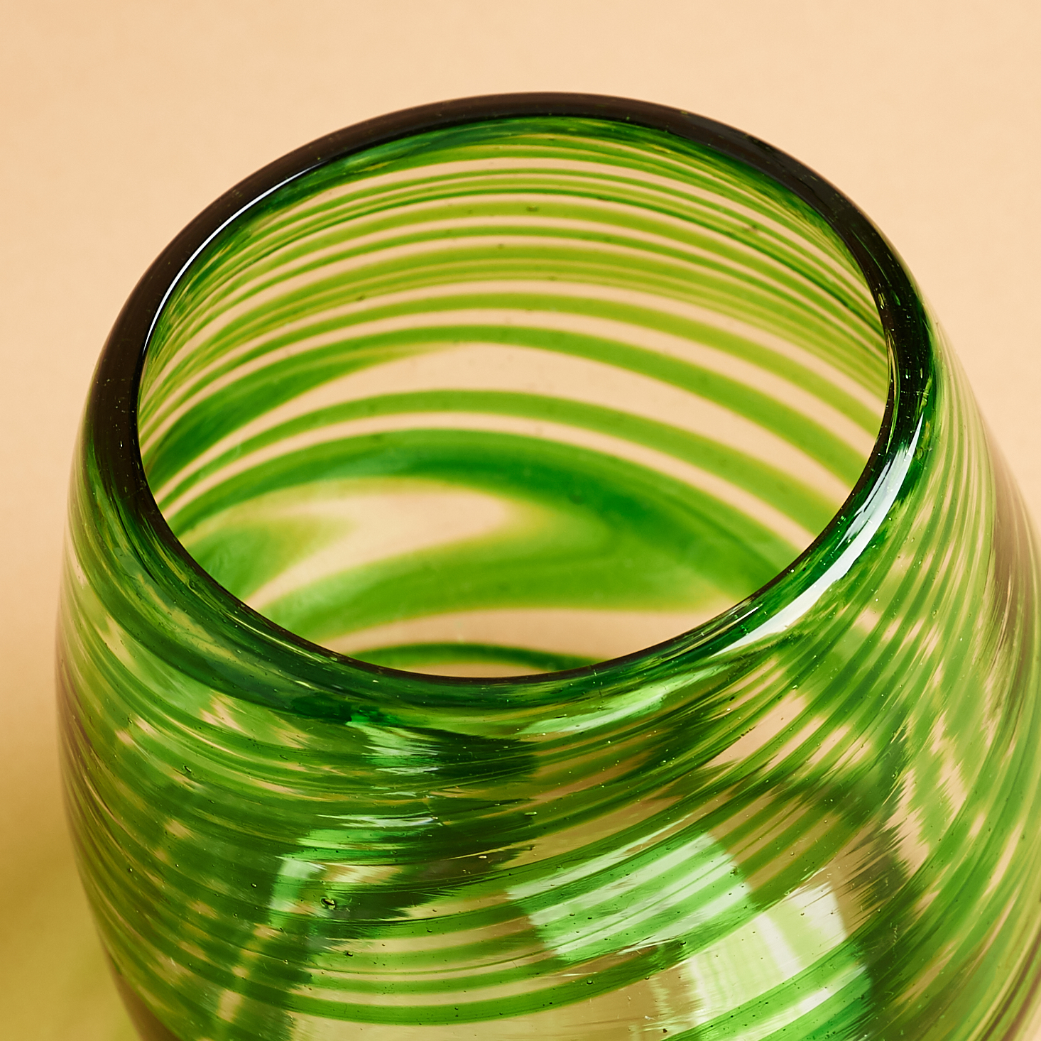 green blown stemless glass rim