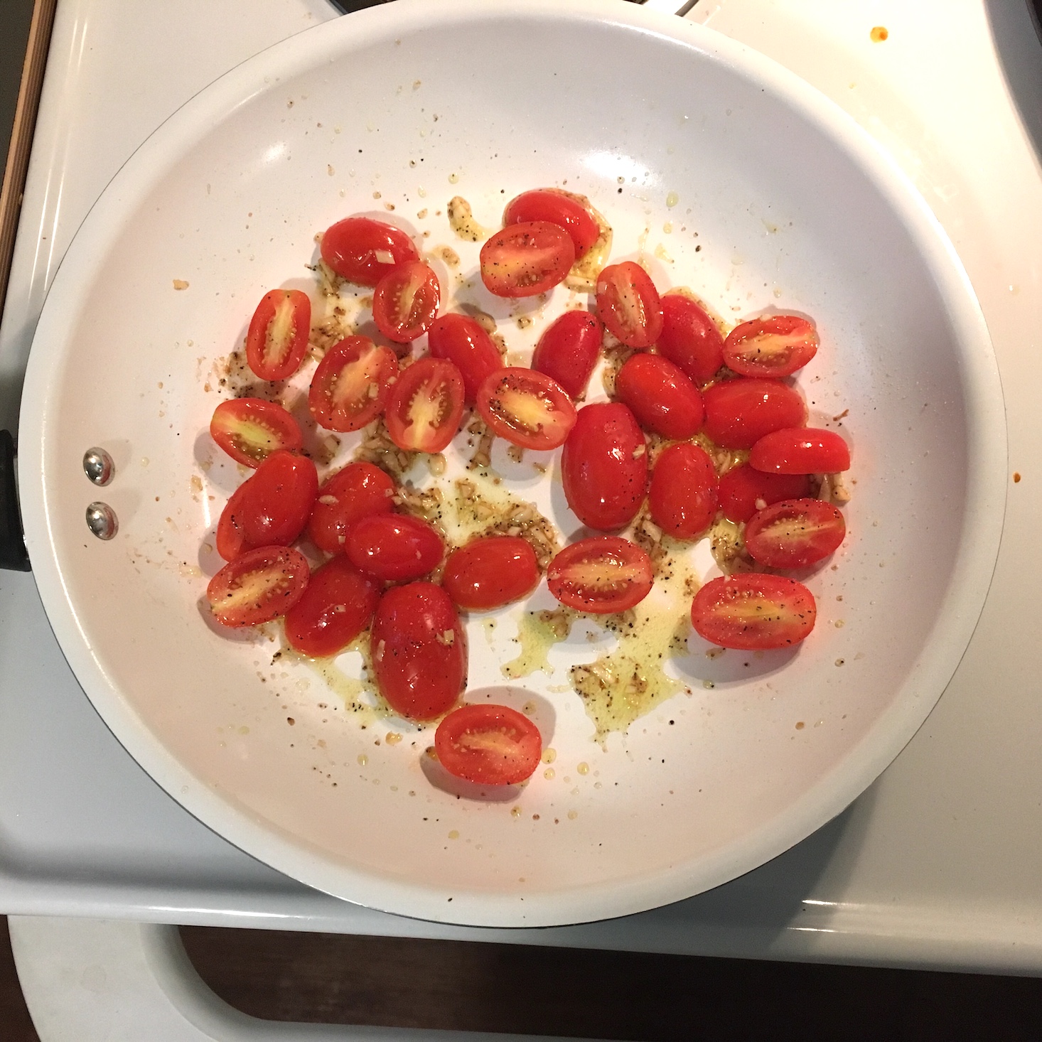 tomatoes cooking in pan