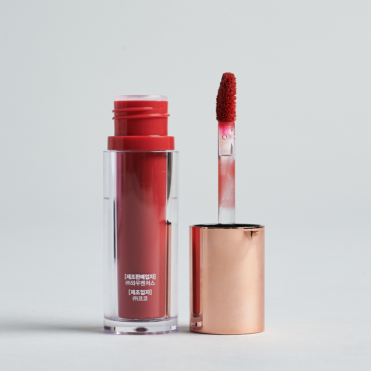 open W. Lab Selfie Velvet Lip Tint with wand next to bottle