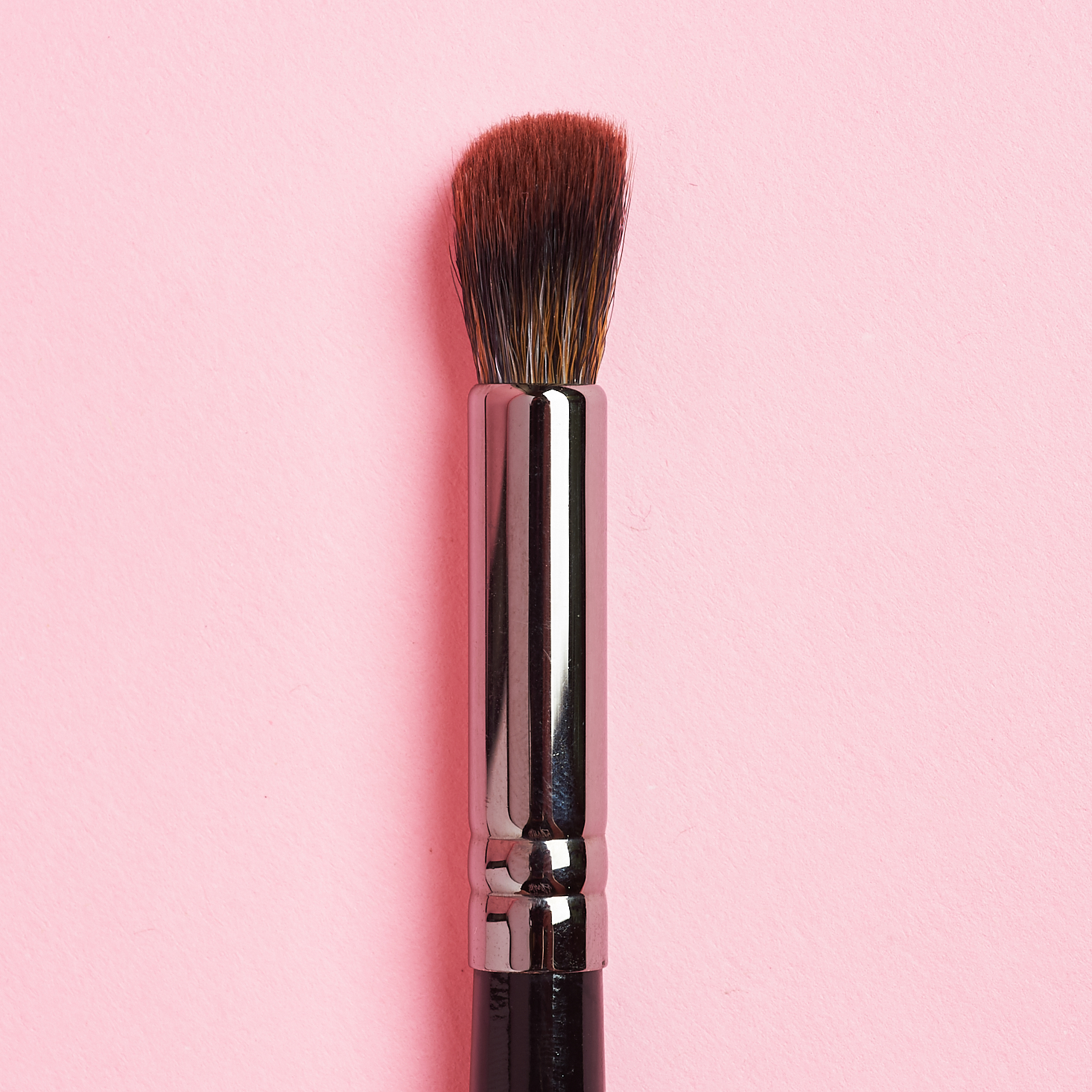 angled brush head with brown bristles