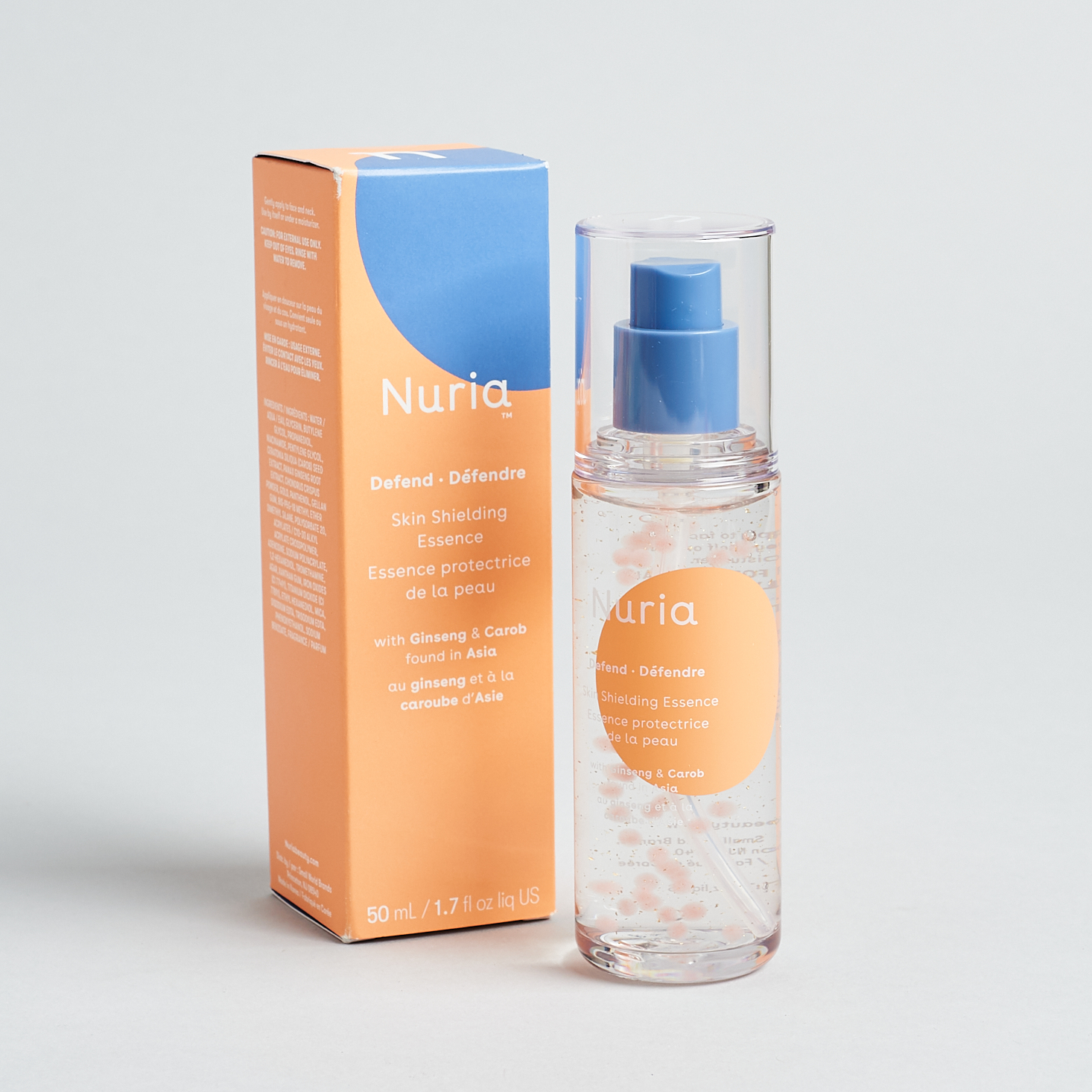 really cool looking clear bottle of serumwith orange and blue packaging