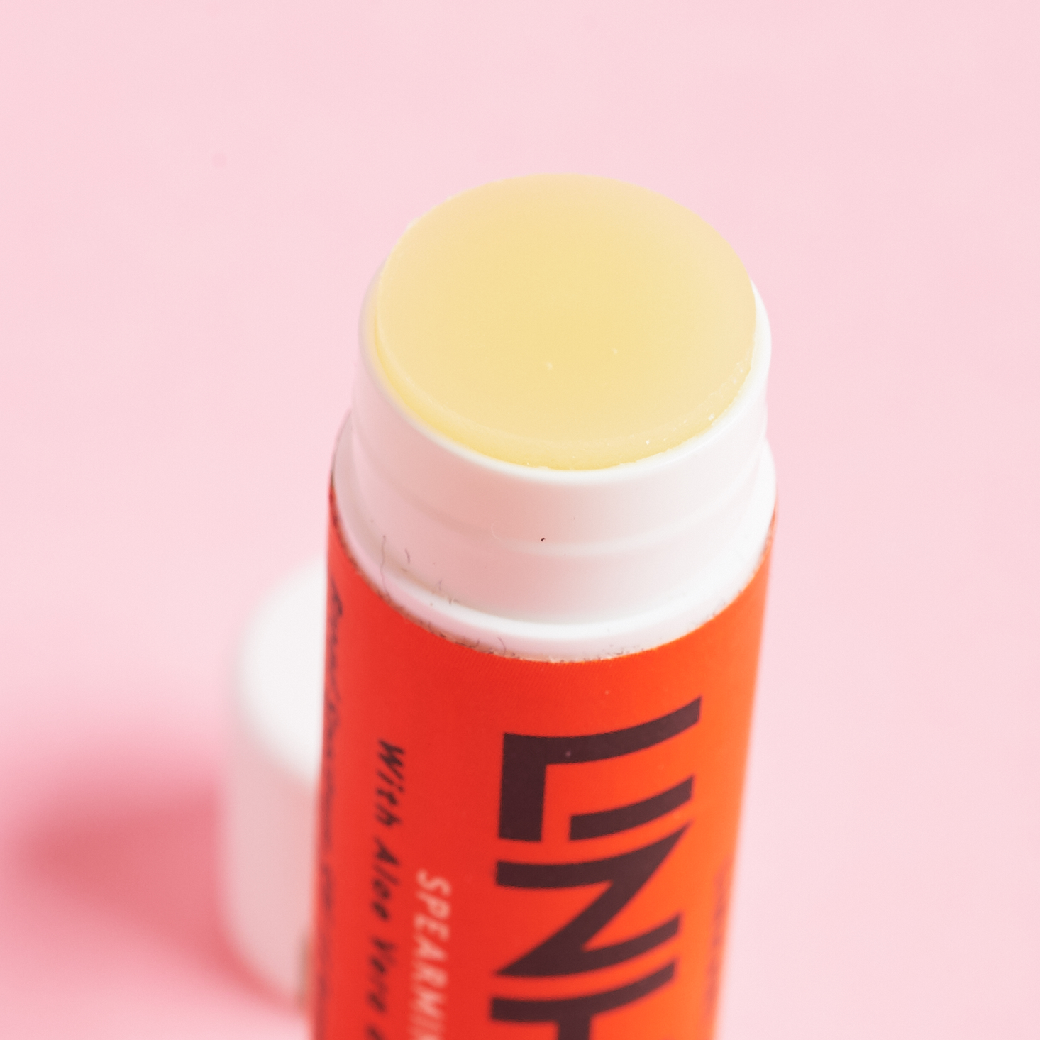 close up of Linhart Lip Balm with cap off