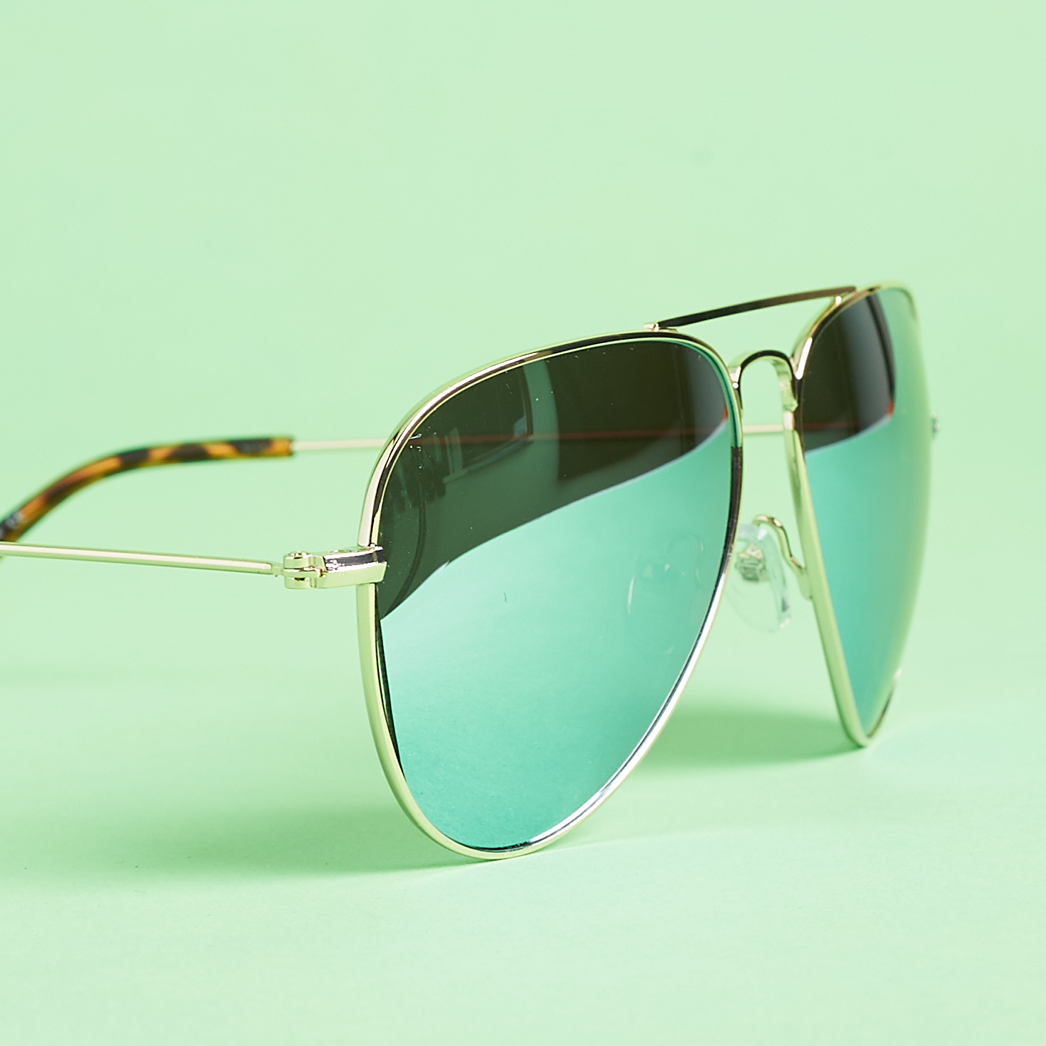 close up of Shades Club Jetsetter in Gold and Mint Blue