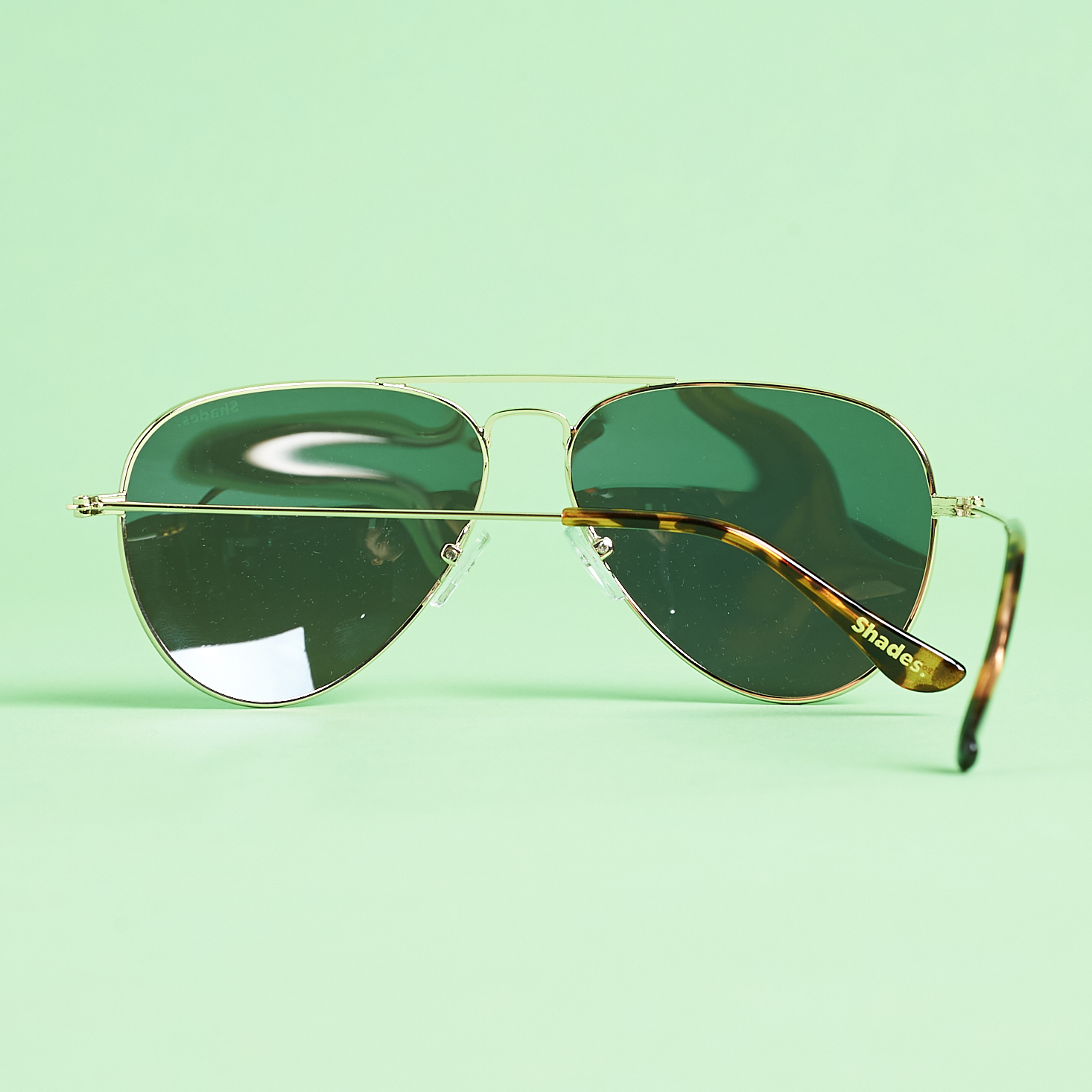 back of Shades Club Jetsetter in Gold and Mint Blue