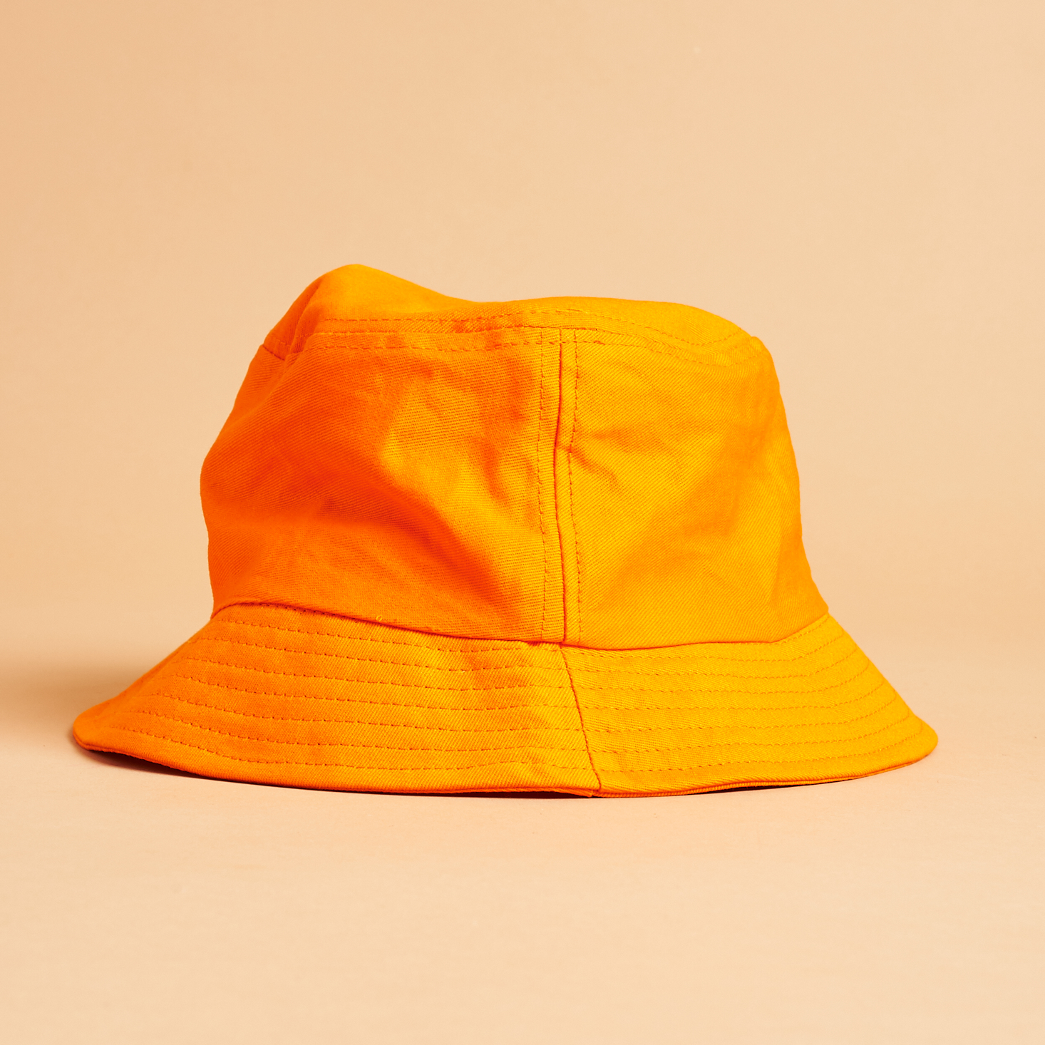 other side of Orange SlutBox Bucket Hat