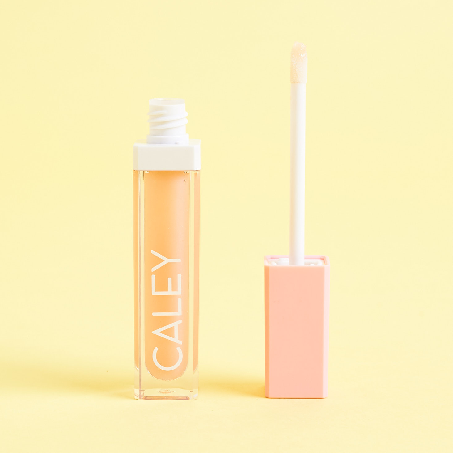 open Caley Cosmetics Lip Gloss in Sunshine Sparkle