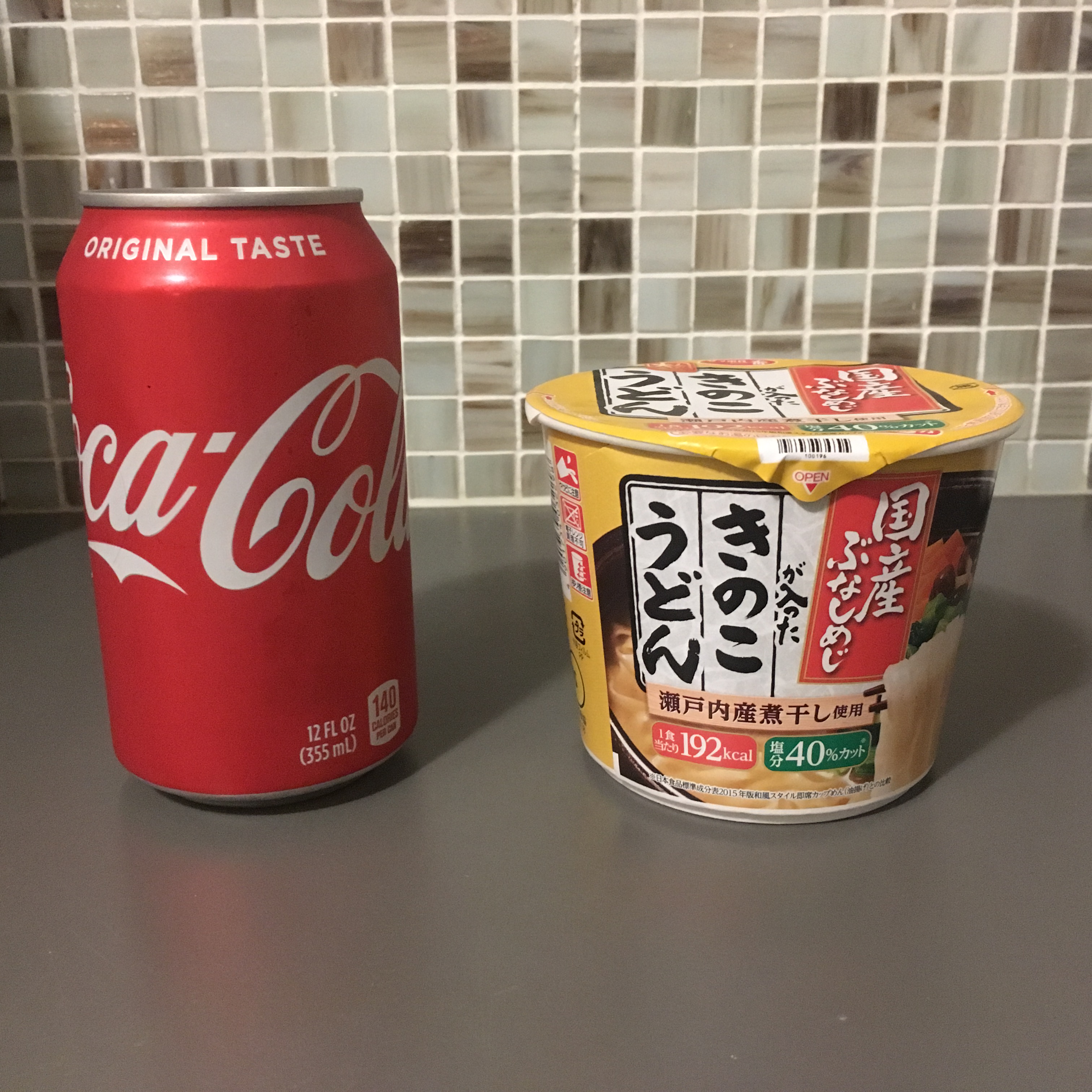 mini bunashimeji mushroom udon next to a coke can for scale