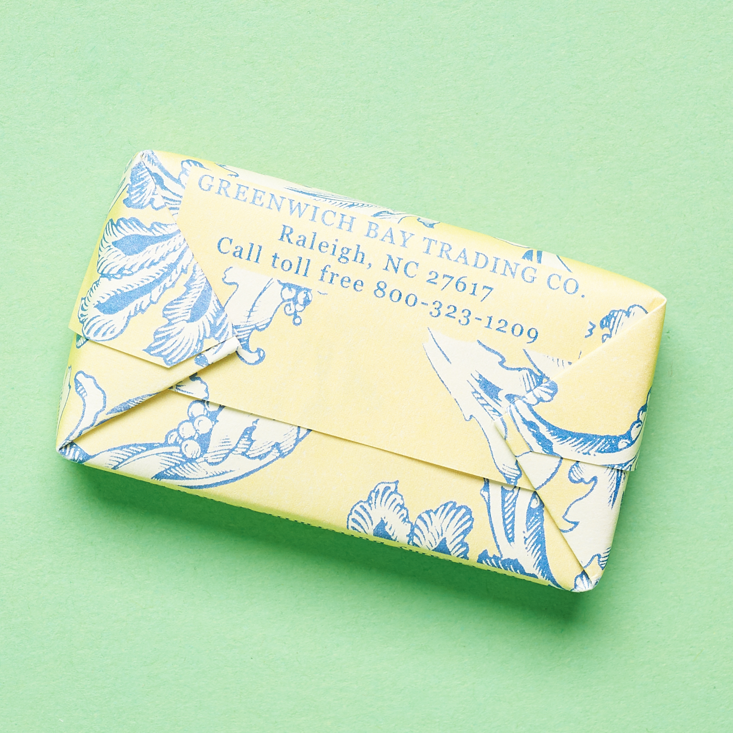 back of yellow and blue toile paper soap wrapping