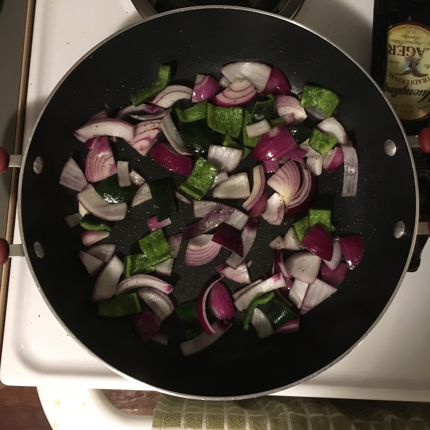 elote-style vegetable tostadas onions and peppers in pan