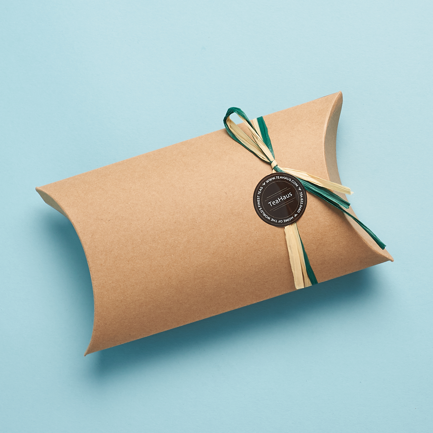 brown paper gift box with ribbon