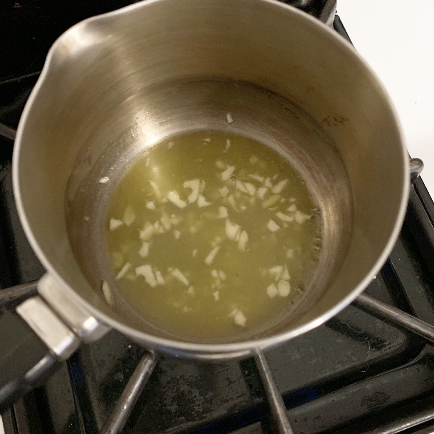 Oil, butter, and garlic in a pot, melting