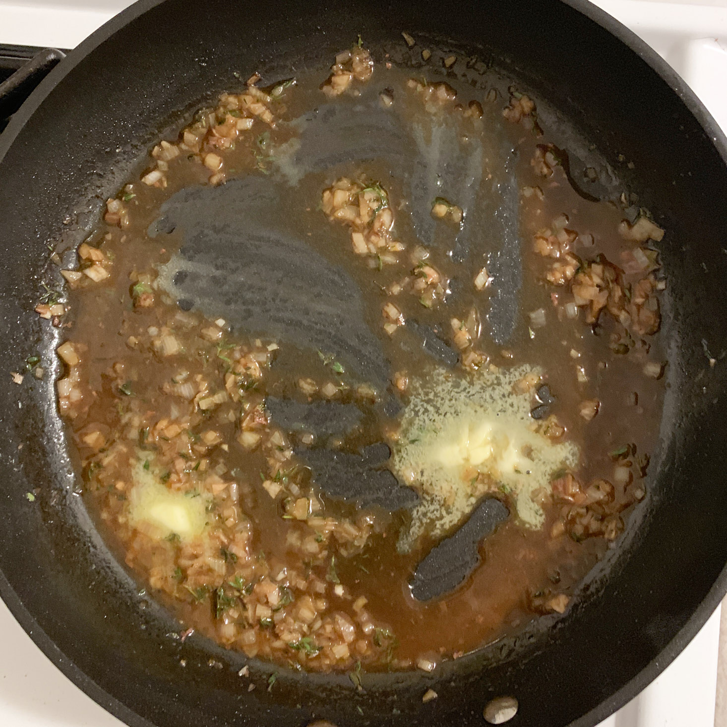 shallot, thyme, stock, and butter in pan