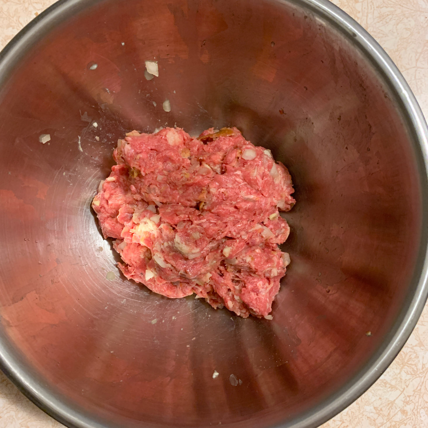 Beef mixture in bowl for meatballs