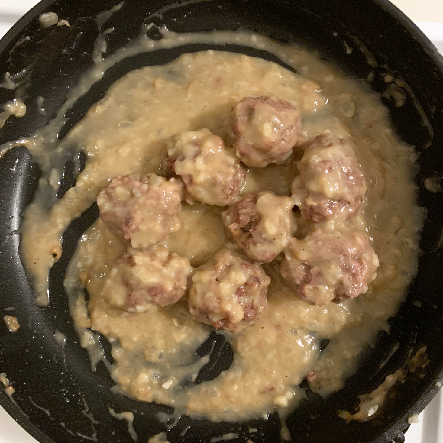 Meatballs in pan with sauce