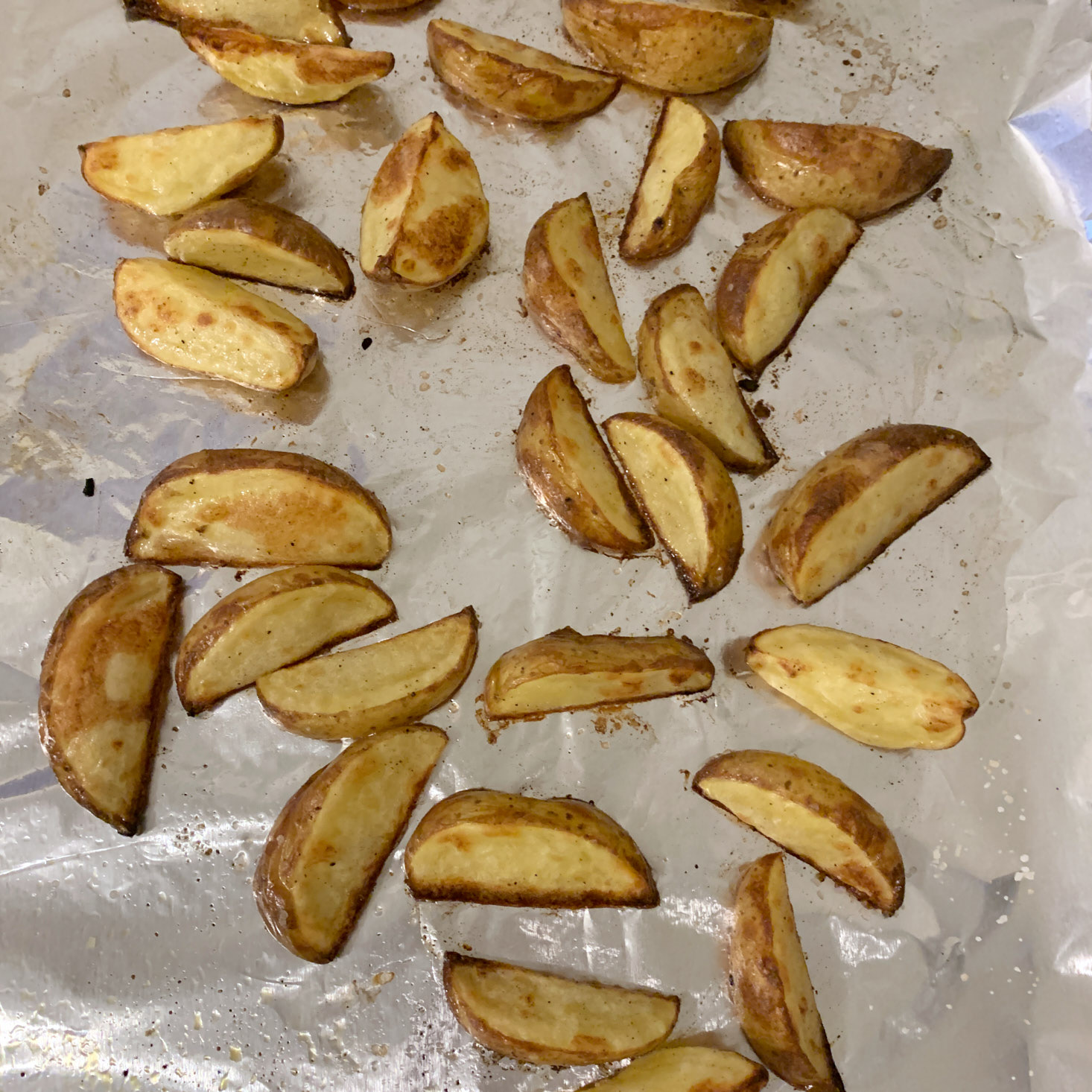 toasted Potato wedges on baking sheet