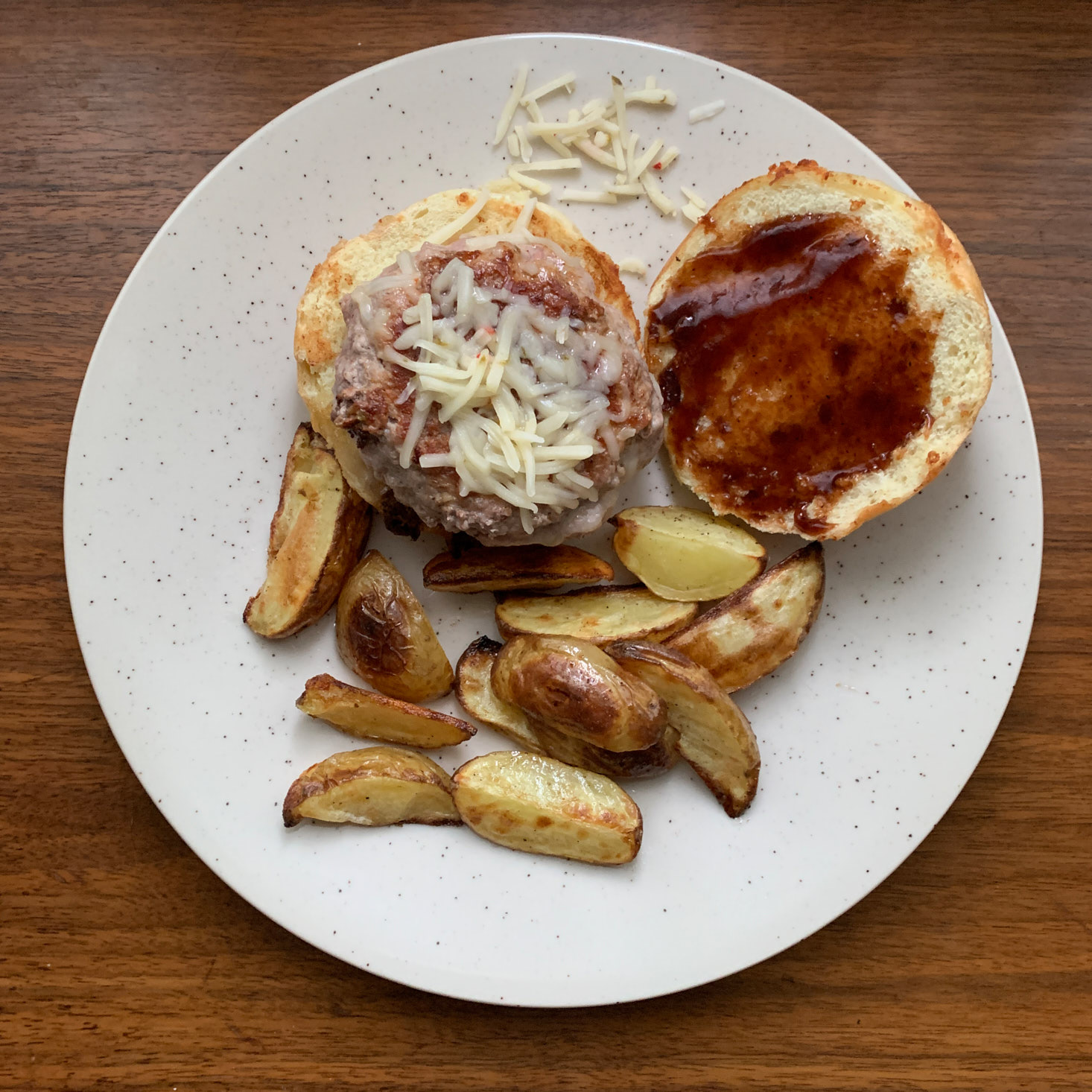 finished Gooey Stuffed Pork Burgers meal on plate