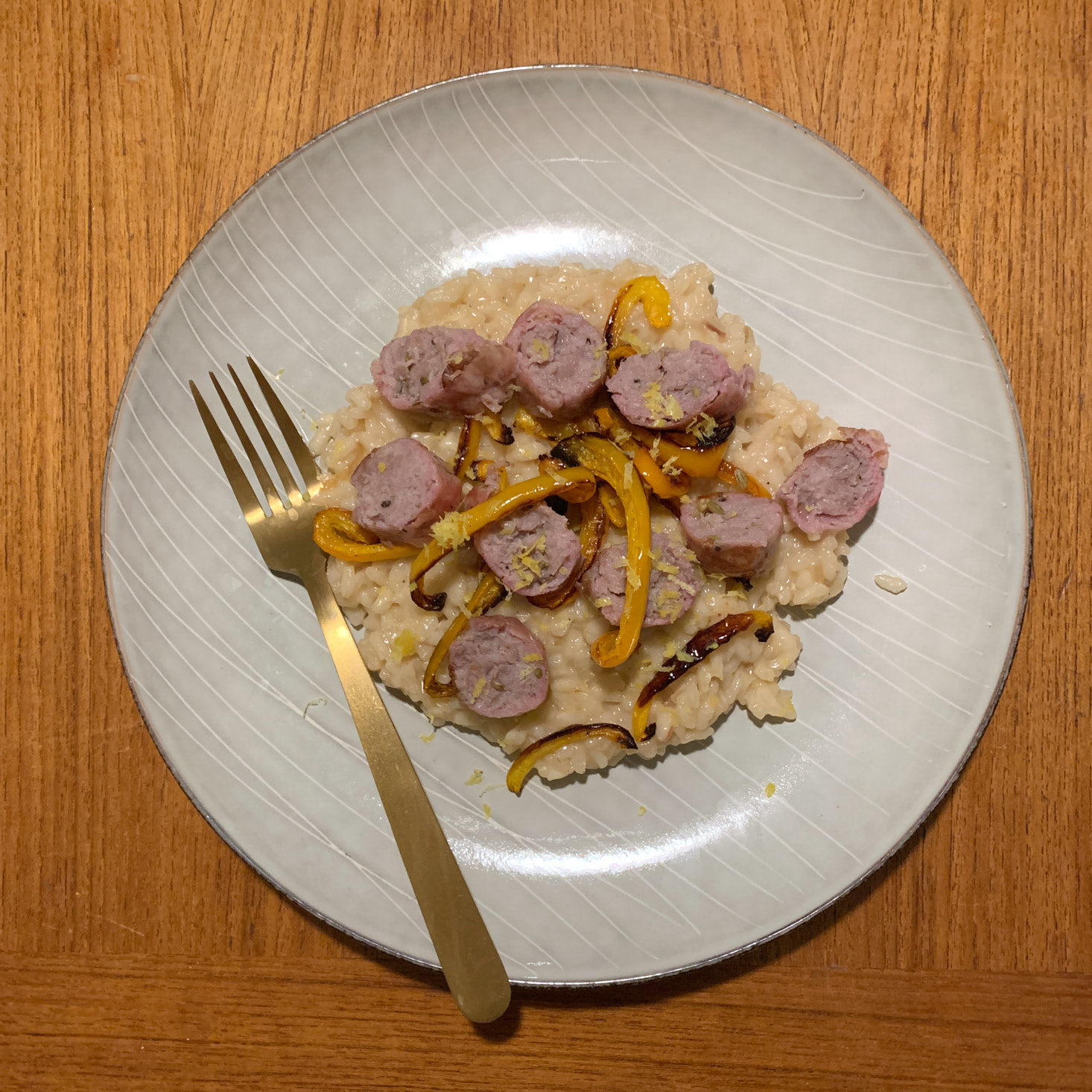 Finished Sausage and roasted pepper risotto meal on plate