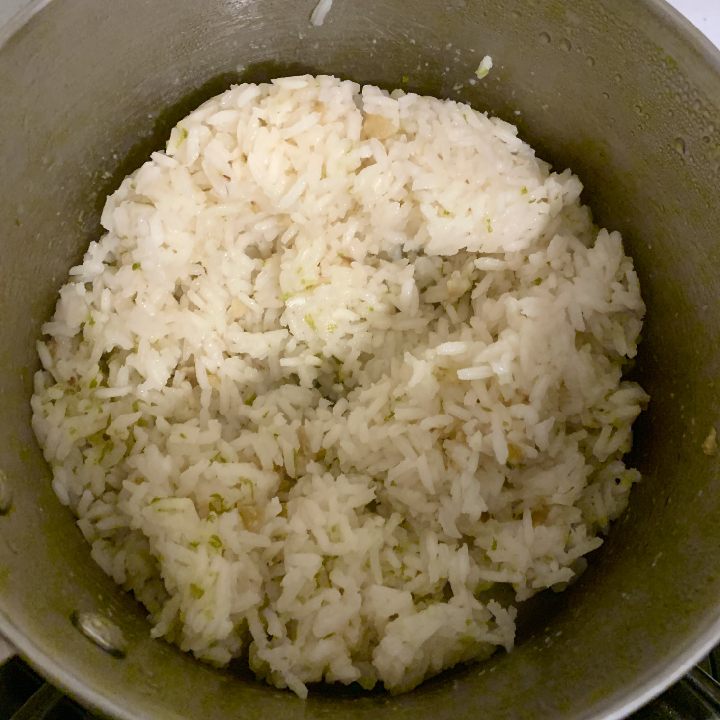 Cooked rice with lime zest in pot