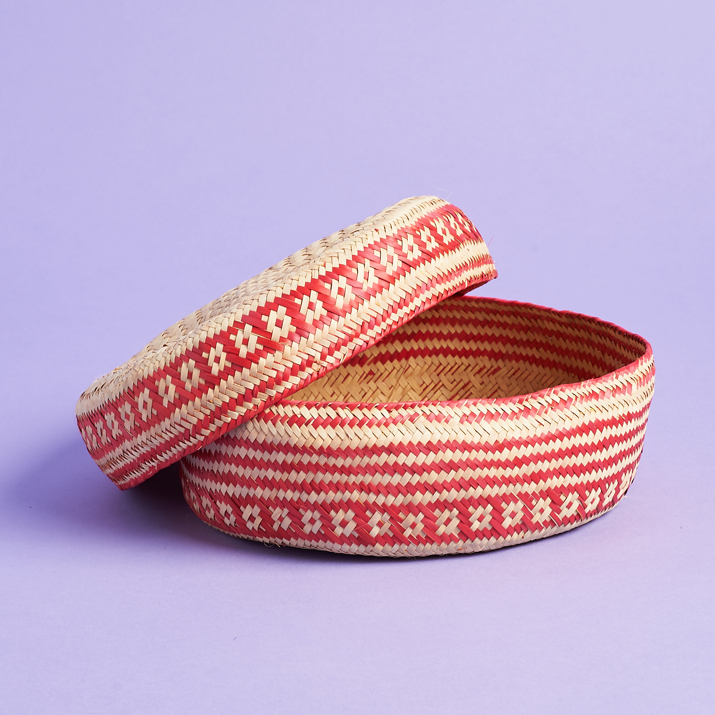 red and natural colored woven basket