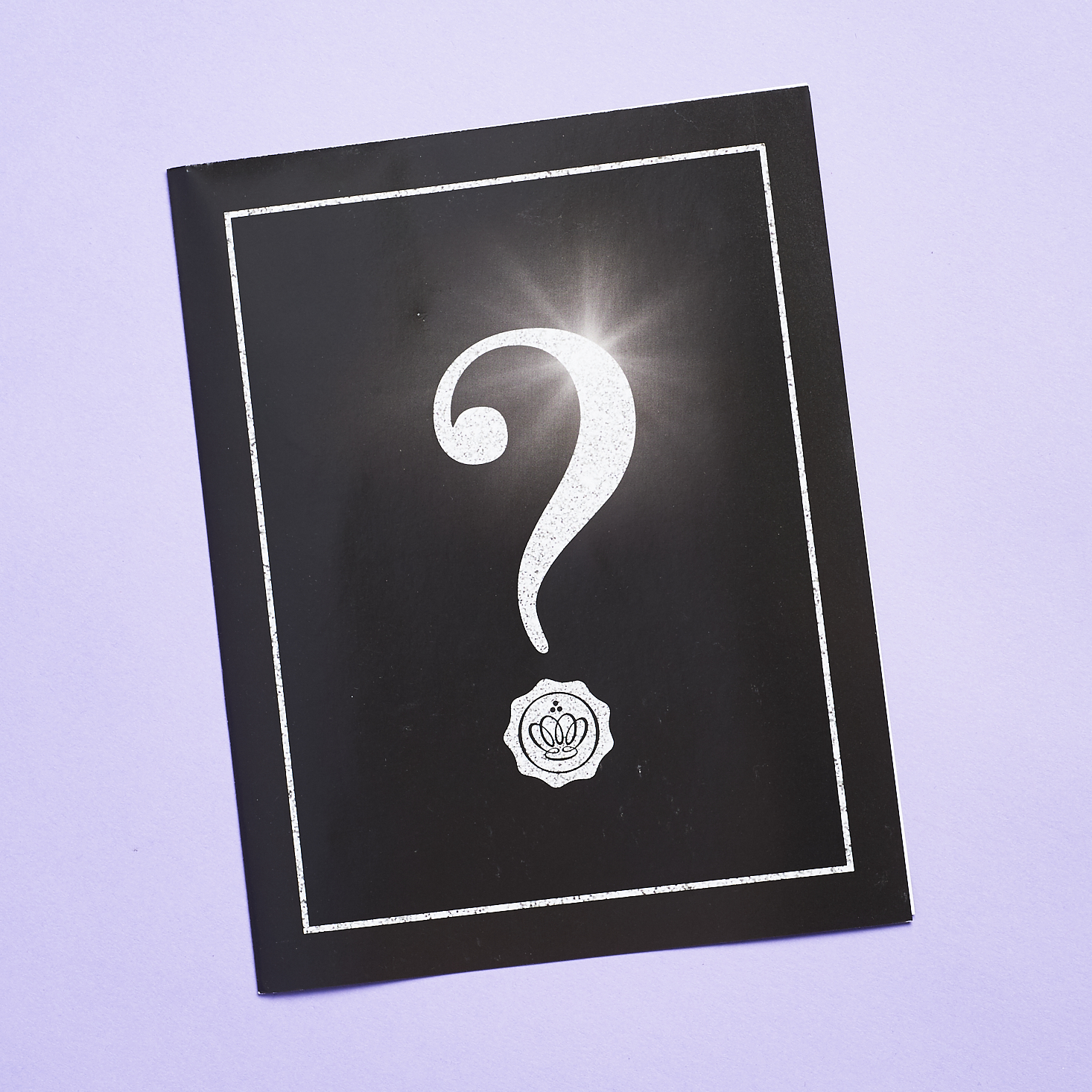 cover ofinfo sheet with black background and giant question mark