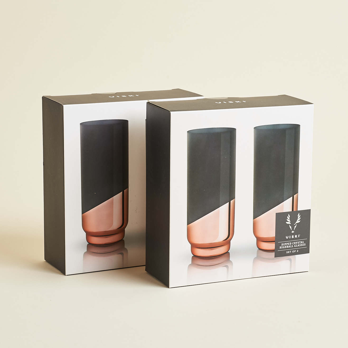 2 pairs of rose gold and grey glass glasses in boxes