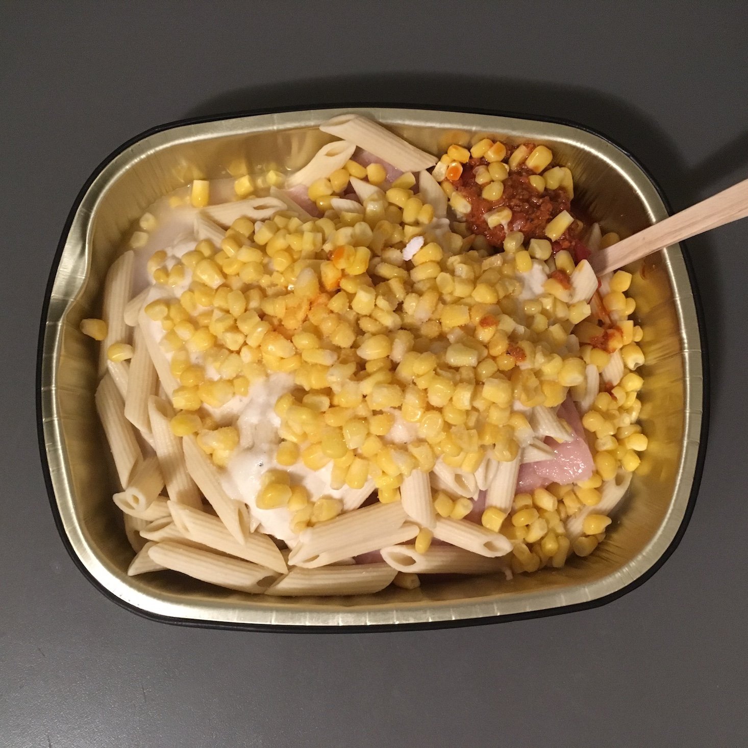 chipotle chicken alfredo baked penne ingredients in pan