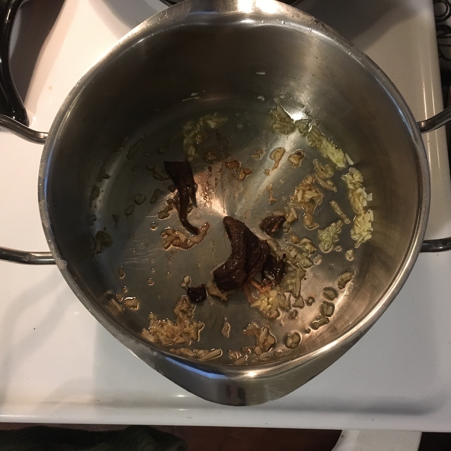 kale caesar flabtread garlic and porcini in pot