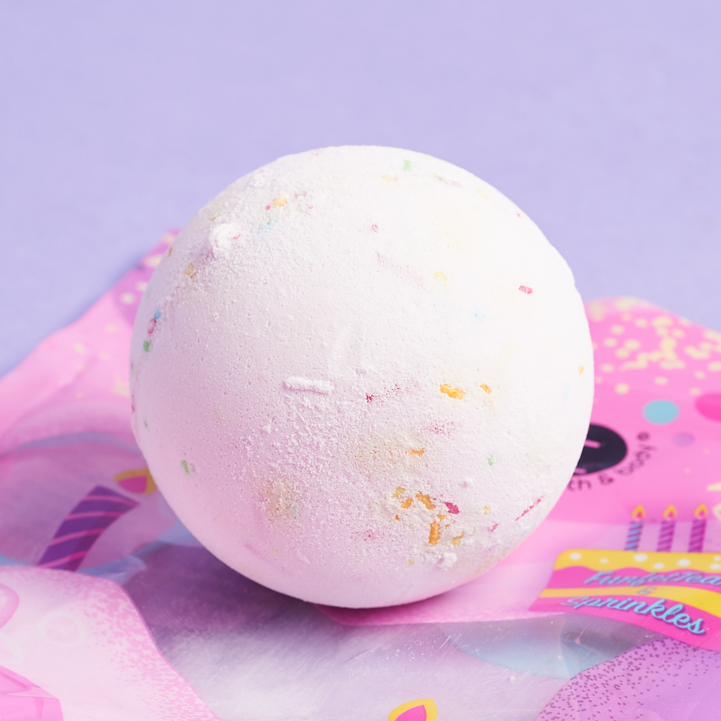 white bathbomb with rainbow sprinkles