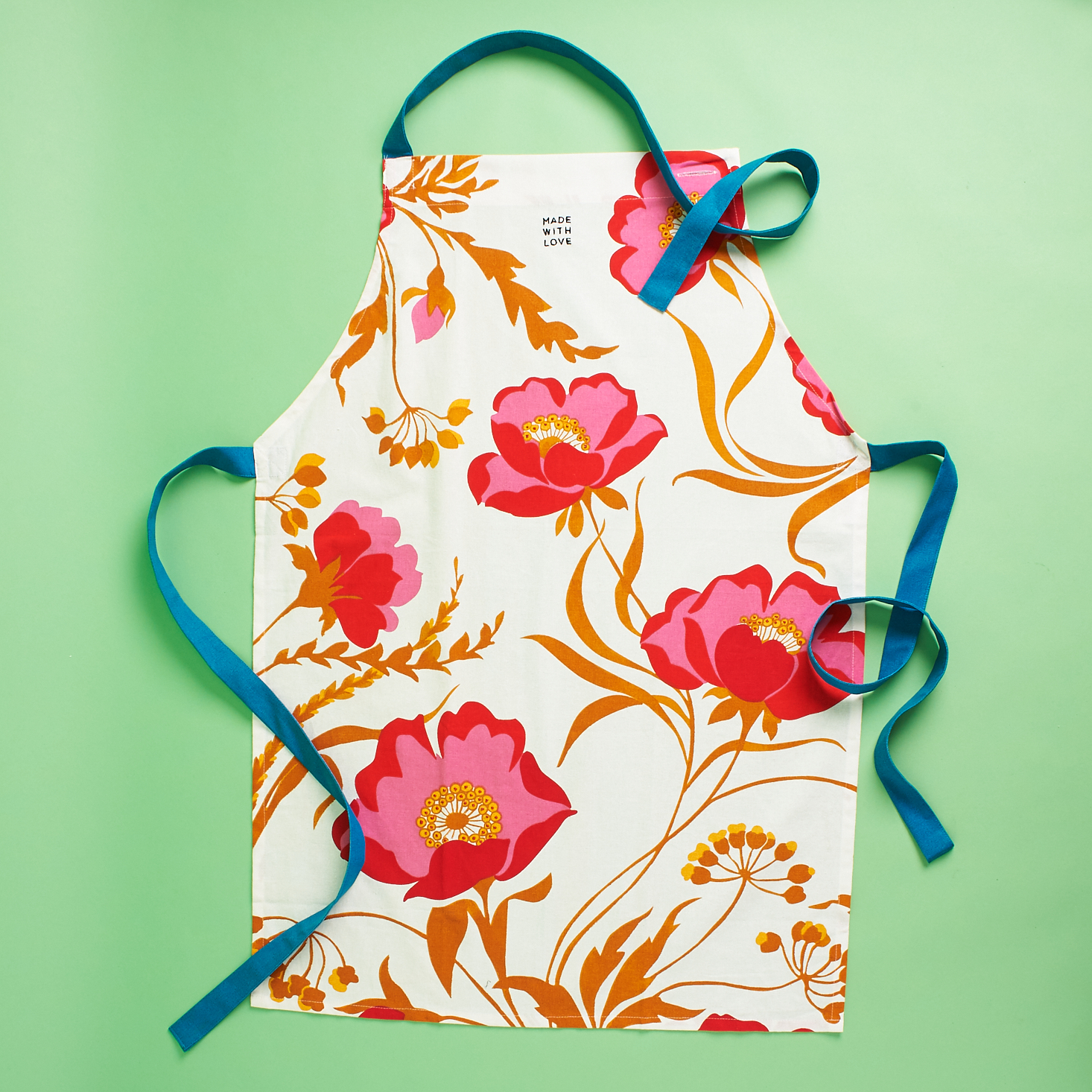 matching apron with floral design and teal elements
