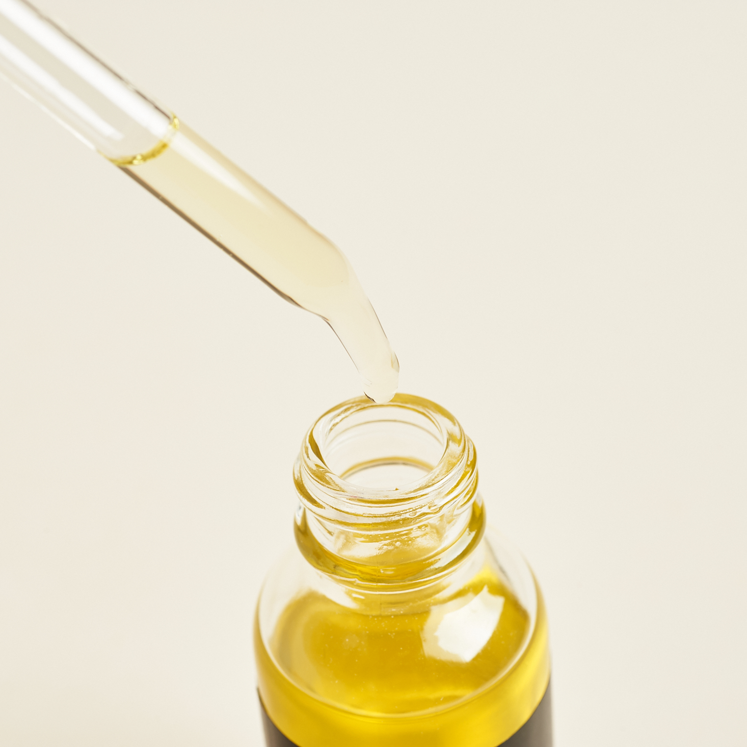 close up of dropper full of Sacred Mama Superfood Beauty Oil