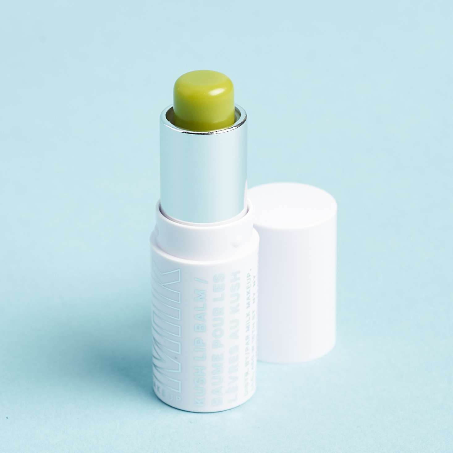 opened Milk Makeup KUSH Lip Balm in Green Dragon