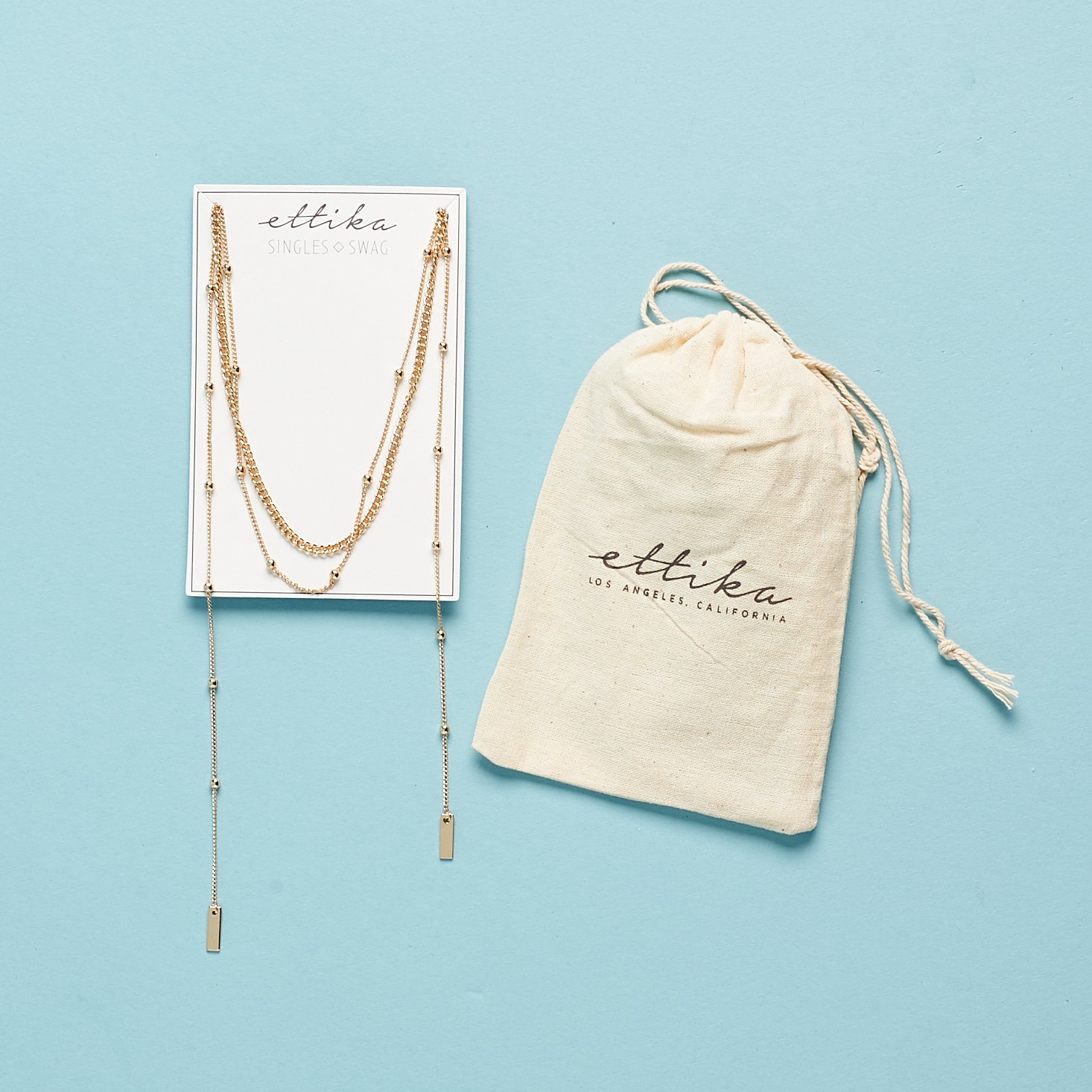 Ettika That New Feeling Layered Necklace on card with pouch