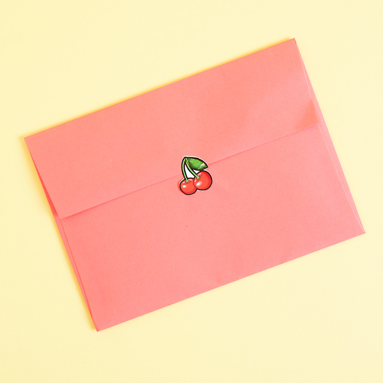 Red envelope with cherry sticker