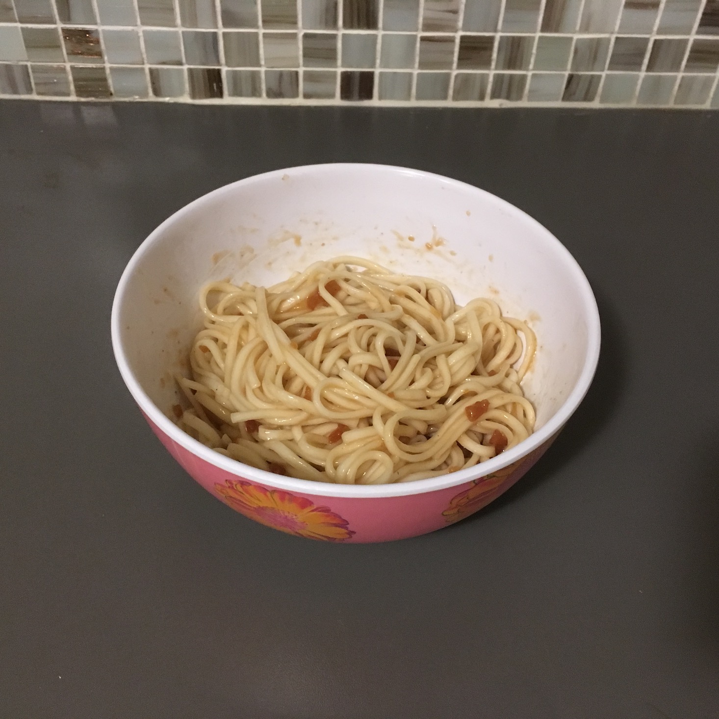 sesame udon sauce packet mixed with noodles