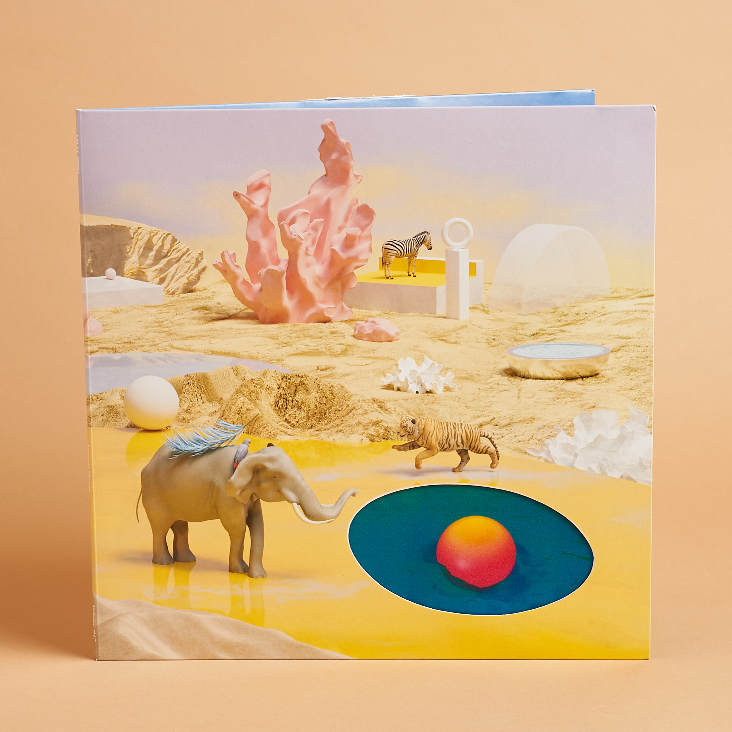 Cover of Vinyl Moon Volume 47 with wild animals against a pastel landscape
