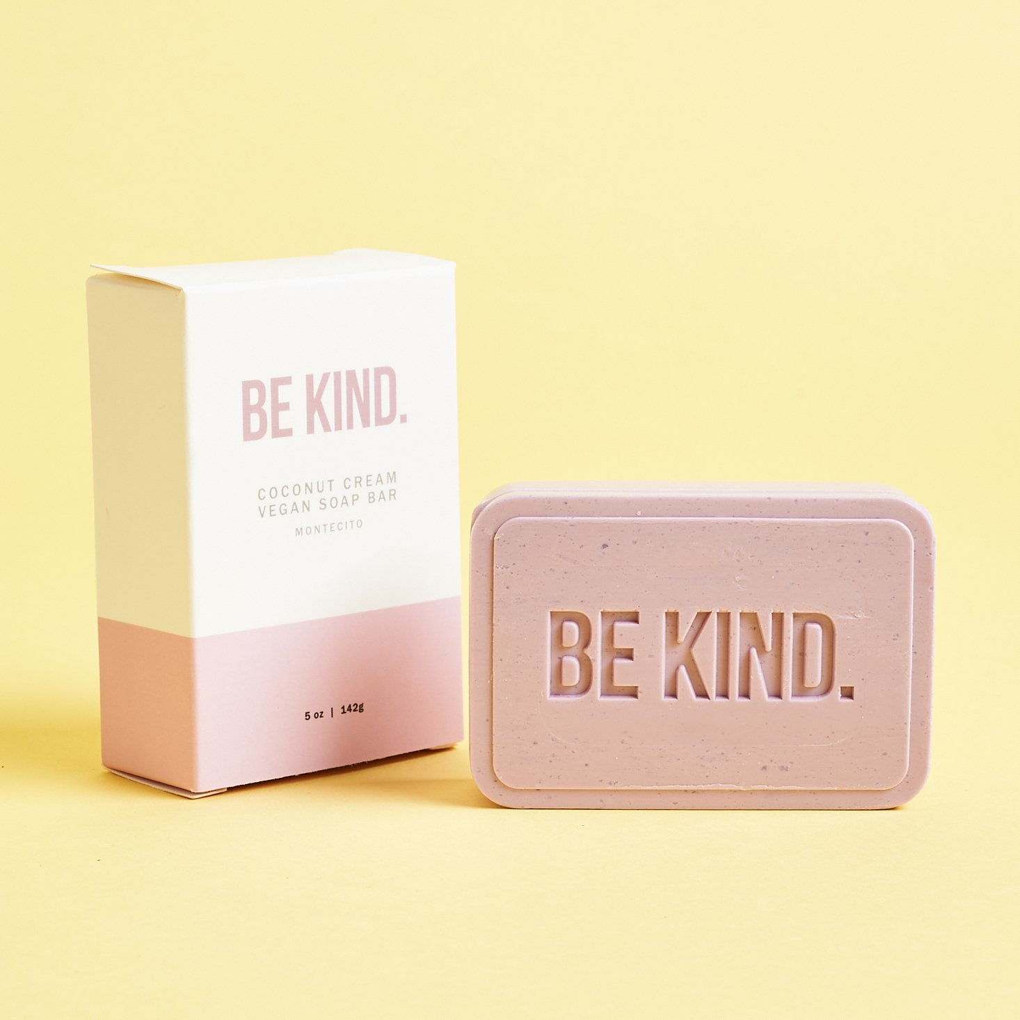 lilac colored soap with BE KIND logo embossed on surface