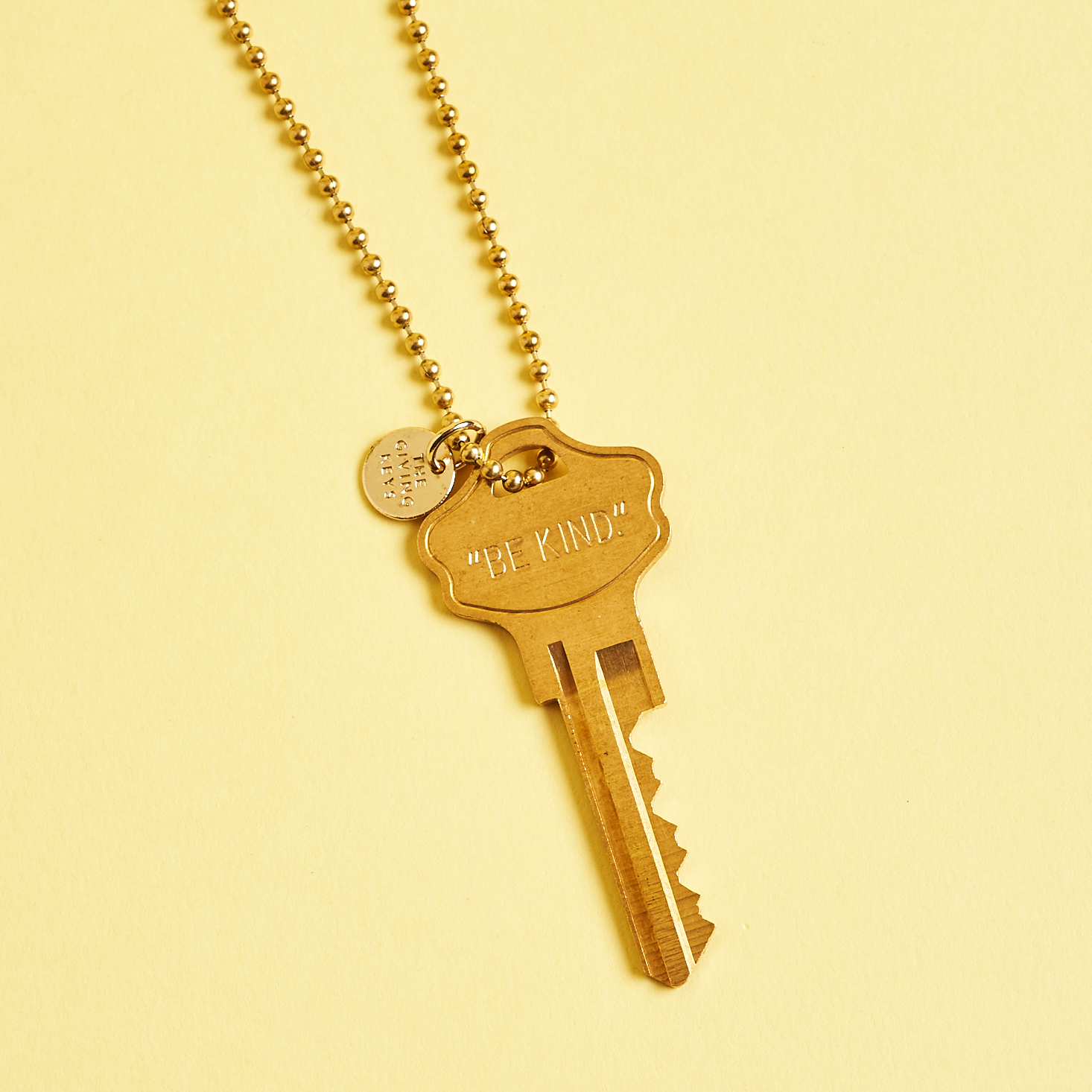 brass key on ball chain