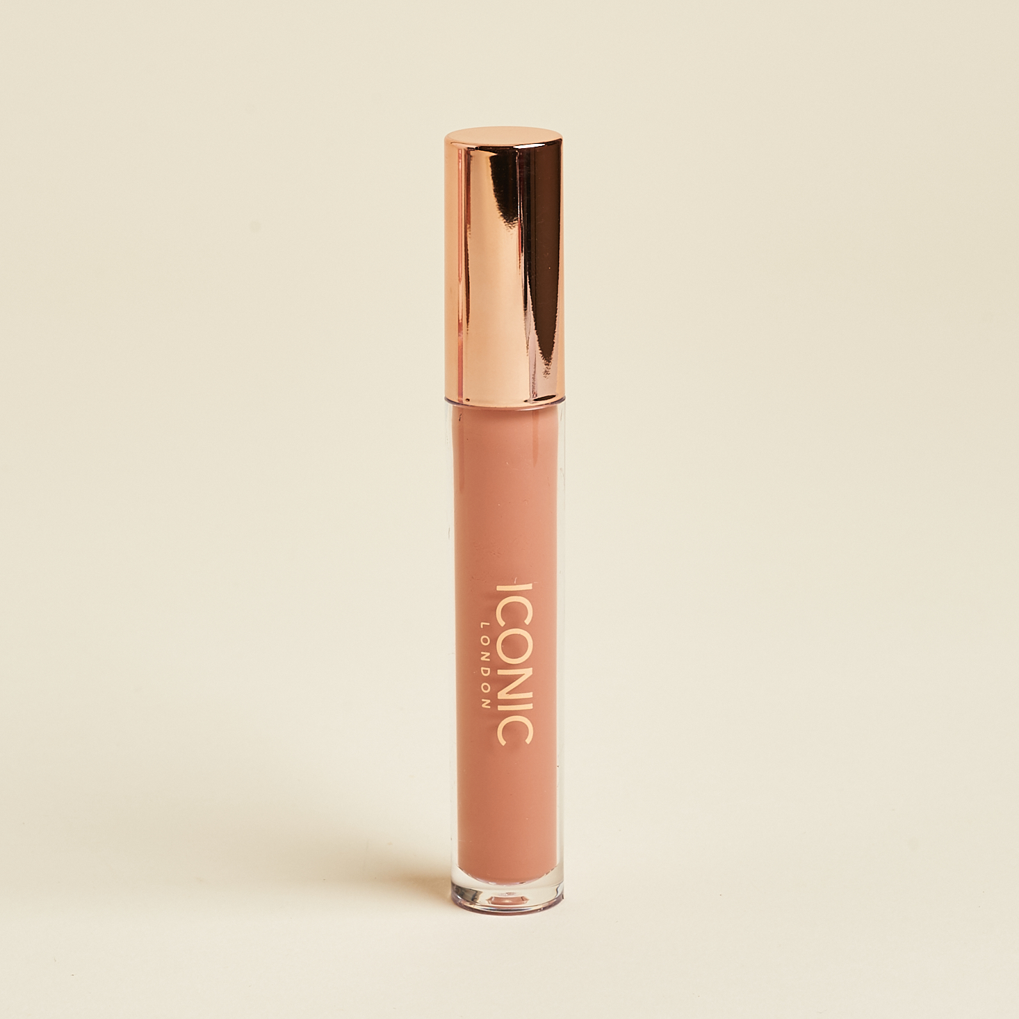 clear tube of nude lipglos with rose gold cap