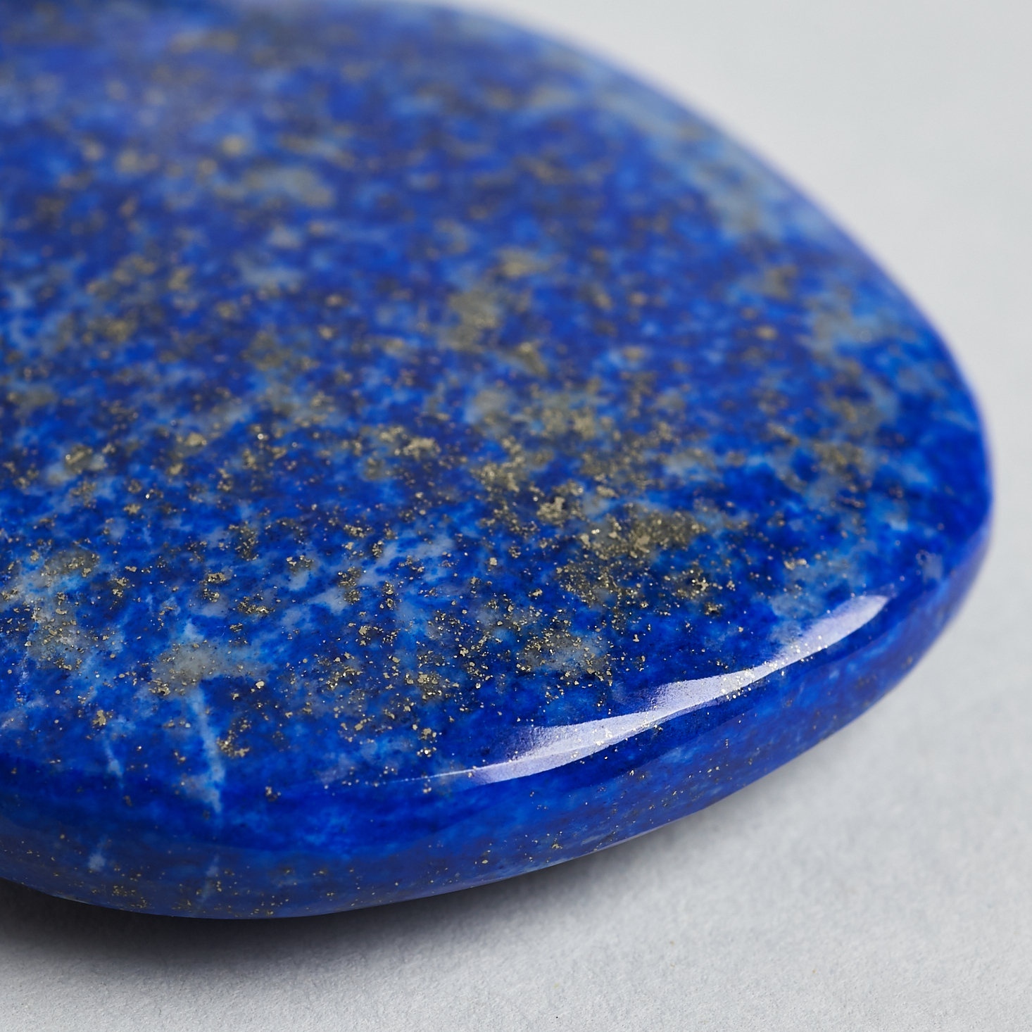 detail of bold blue color and metallic flakes in palm stone