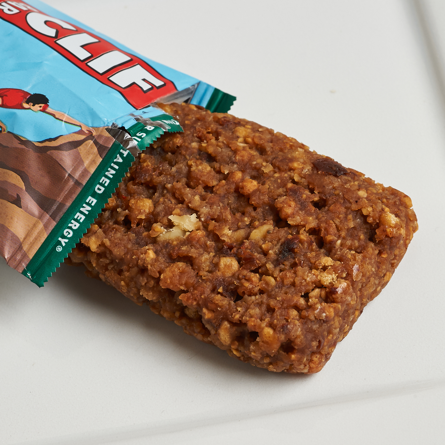 Oatmeal Raisin Walnut Clif Bar coming out of package onto plate