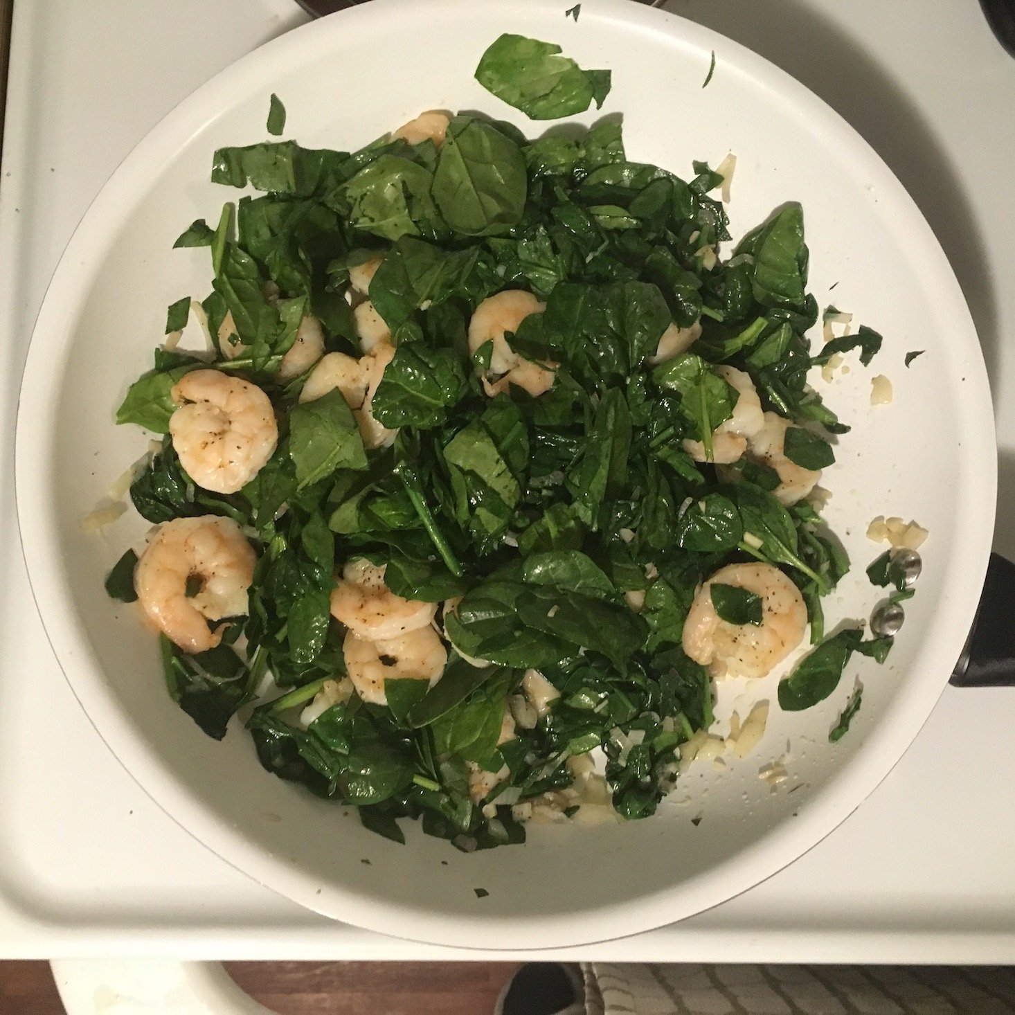 shrimp florentine in pan with spinach