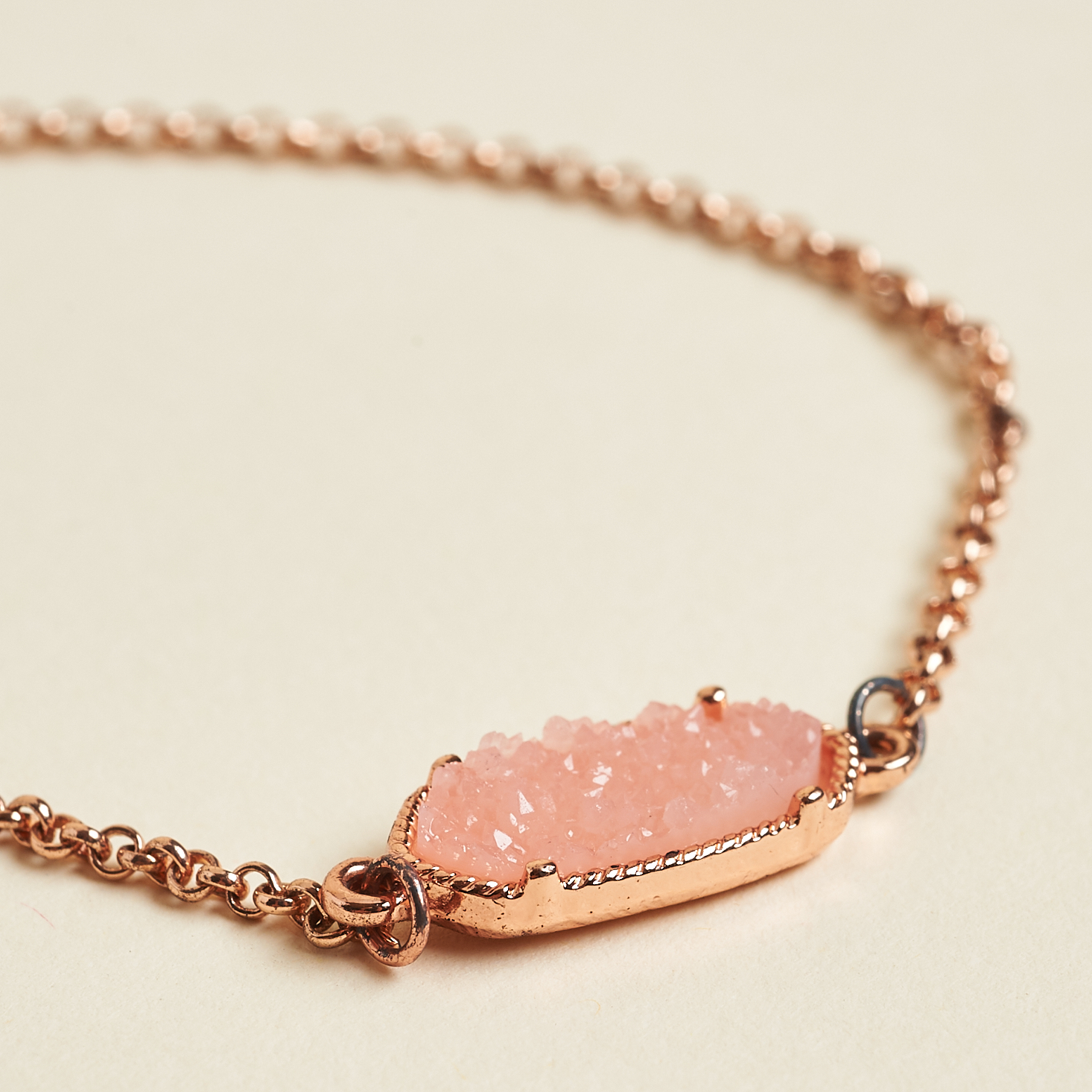 close up of Indigo Authority Mila Peach Quartz Adjustable Chain Bracelet