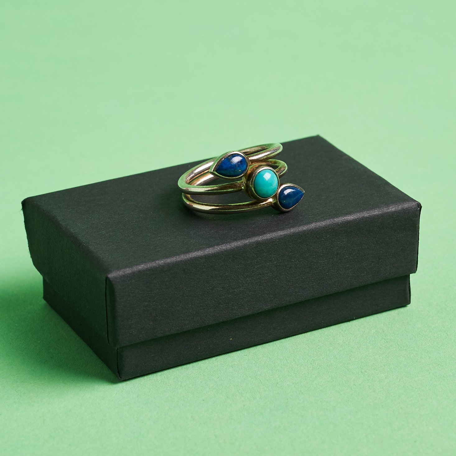 black box with three stone ring