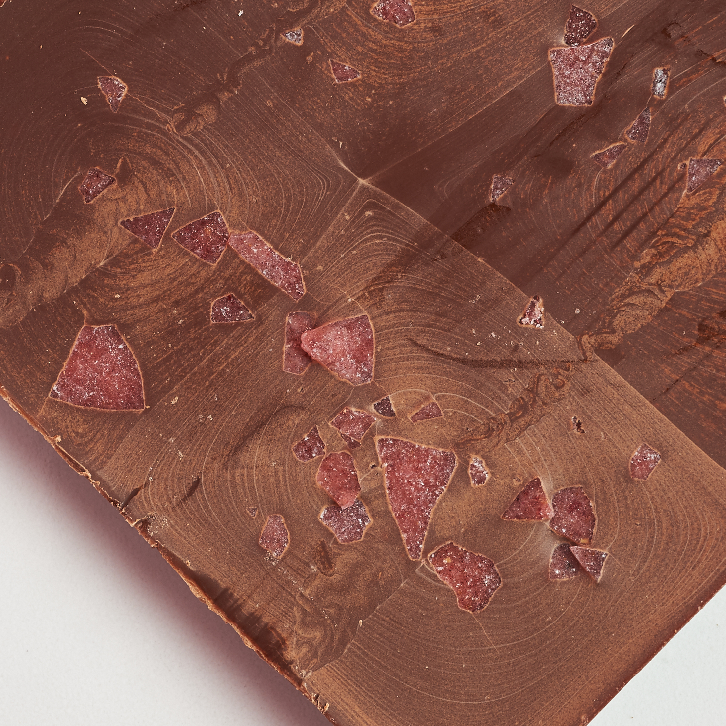 bottom of chocolate has red petals poking through