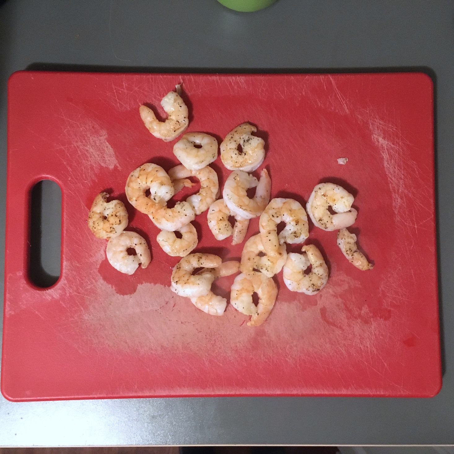 shrimp on a red cutting board